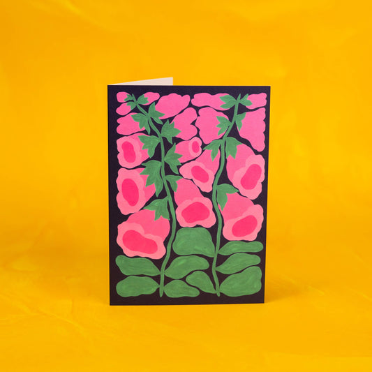 Card with pink floral design on a yellow background