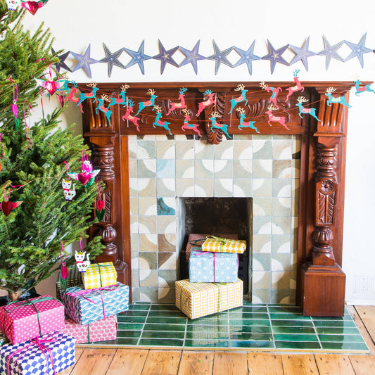 East End Press Garland on fireplace.
