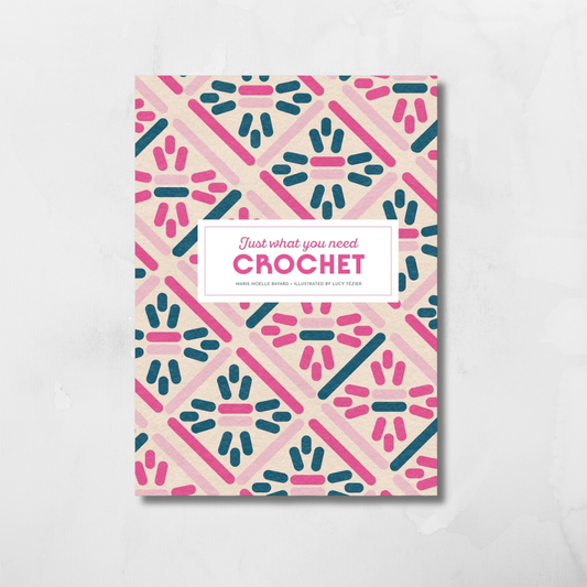 A square crochet pattern book or booklet titled 'Just what you need CROCHET' by Sarah Michelle Barnes, illustrated by Lise Reif, featuring a pink, teal, and beige geometric pattern on a light gray marble background.