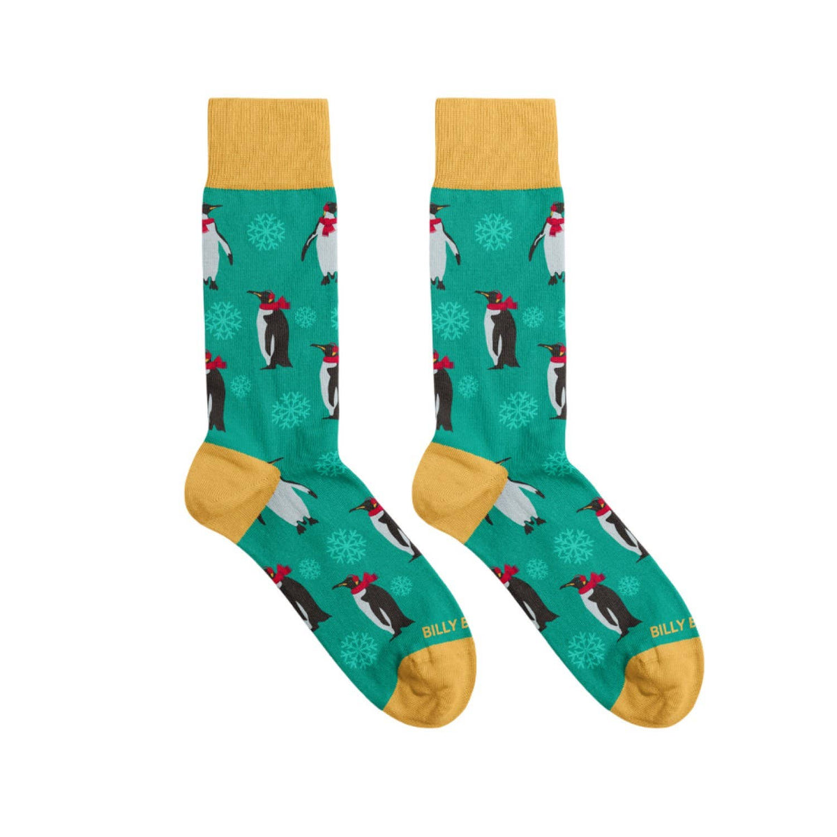 Christmas green socks with penguin design and yellow accents on a white background