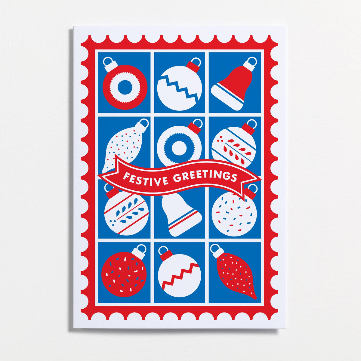 A festive Christmas greeting card by Crispin Finn with a red and blue holiday design, featuring ornament illustrations and a red banner reading 'Festive Greetings' on a white background.
