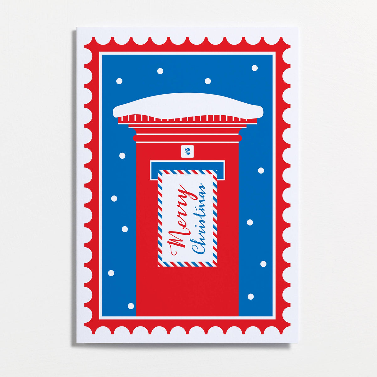 A festive Christmas greeting card by Crispin Finn featuring a red post box with a blue snowy background and a white envelope reading 'Merry Christmas' in red script, set against a light gray background.