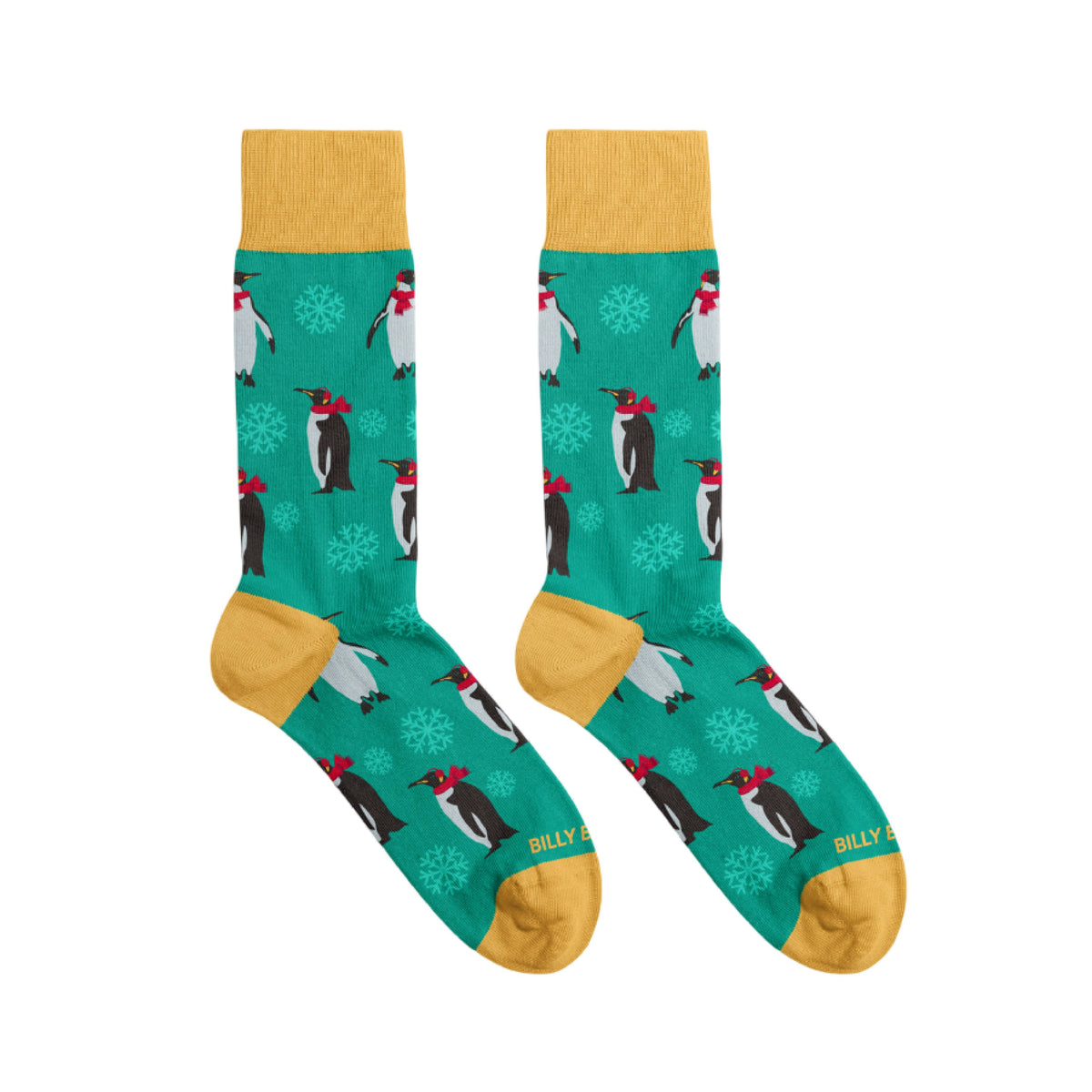 Green Christmas socks with penguin design and yellow accents on a white background