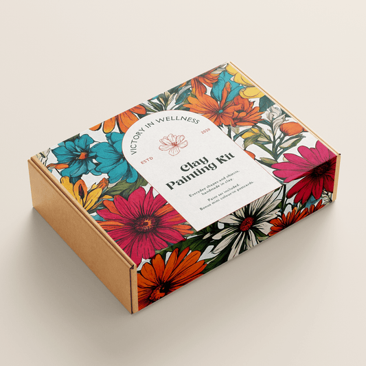 Floral-themed clay painting kit box on a beige background
